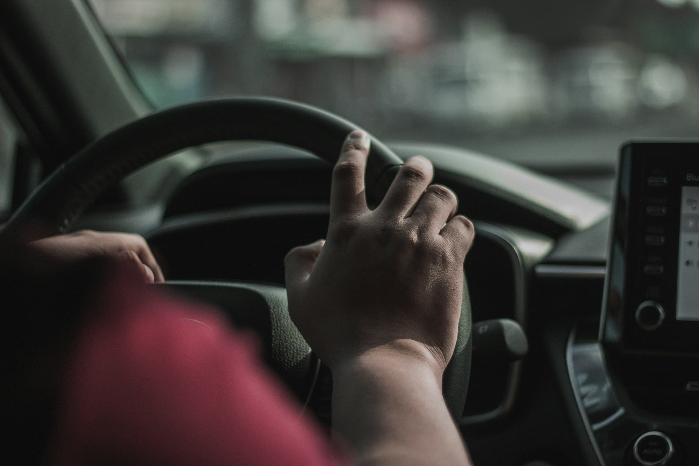 A broker working the search from behind the wheel
