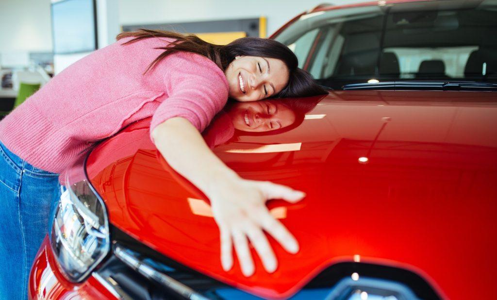 Woman Hugging Red Car
